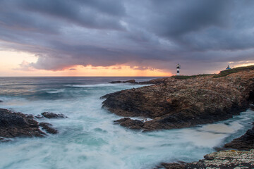 Sunrise and long exposition at Ribadeo Lighthouse, Galicia, Espana, after a storm