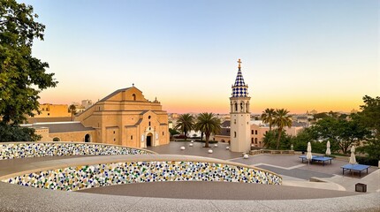 Obraz premium Architectural Landmark with Colorful Tower and Mosaic Plaza