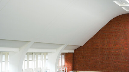 Spacious public interior with bright white architectural walls and details