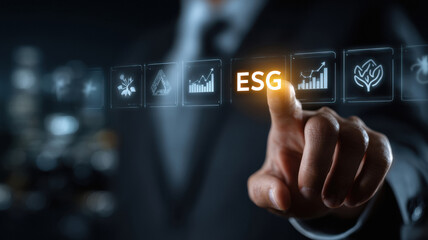 businessman touching a digital screen with ESG icon