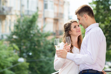 Couple in love. Man and woman drinking champagne together. Wedding day.