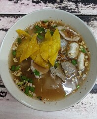 Culinary Art: A close-up view presents a steaming bowl of authentic and appetizing food. The...