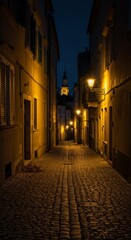 Obraz premium Cobblestone alleyway illuminated by warm streetlights at dusk