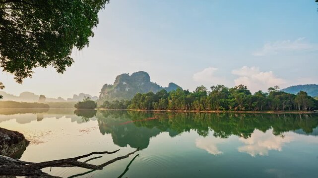 Time lapse Pastel Pink Sunrise over the swamp. Peaceful Seascape over lake Nong Thale Krabi. with Clouds and forest Reflected on Sea Water. Panoramic Horizon Coastal Landscape. Landscape Nature