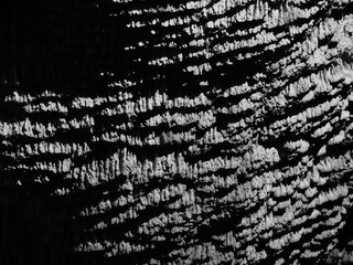 black and white images of a sinter limestone wall illuminated by bright light