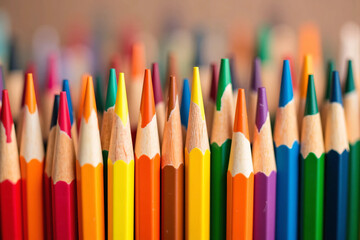 Fototapeta premium Close-up macro photograph of sharpened multicolored colored pencil tips arranged tightly with vibrant pigments and soft lighting, showcasing texture and symmetry for creative and education visuals