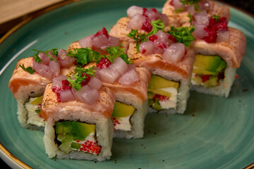Delicious and Colorful Sushi Roll Arrangement Featuring Fresh Fish, Avocado, and Garnishes Perfect...