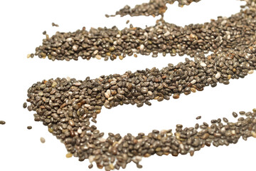 Chia seeds are scattered on a white table surface.
