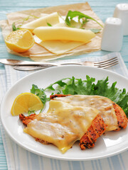 grilled chicken breast topped with melted cheese