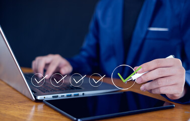 Businessman mark checkboxes, Survey form, check marks on checklist,Checklist concept.