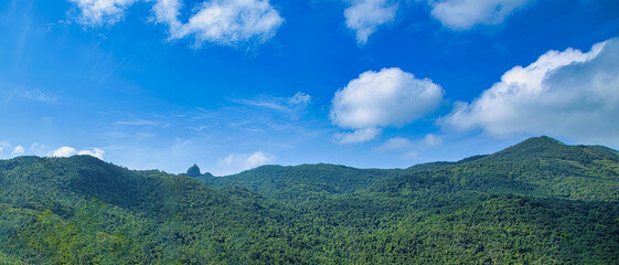Fototapeta premium Hon Chuong Tower, an ancient Champa tower, dating from the 13th-14th century, built on top of a giant rock on the top of Hon Chuong of Ba Mountain range in Phu Cat, Binh Dinh, Vietnam