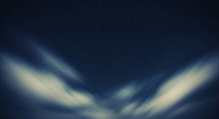 Dreamy night sky with wispy clouds and twinkling stars, a serene celestial view