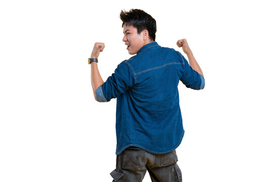 An asian man standing, turned back and flexing his biceps. A portrait shot in a studio setting.