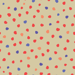 colorful irregular polka dot seamless pattern on beige background for kids fabric, party decor, wrapping and playful design.