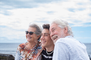 Portrait of a carefree family group of three multigenerational people, grandparents and nephew...