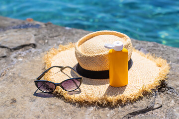 Sunscreen against the sea. Selective focus.