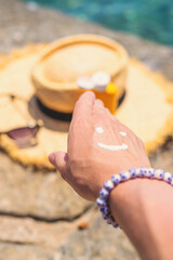 Sunscreen against the sea. Selective focus.