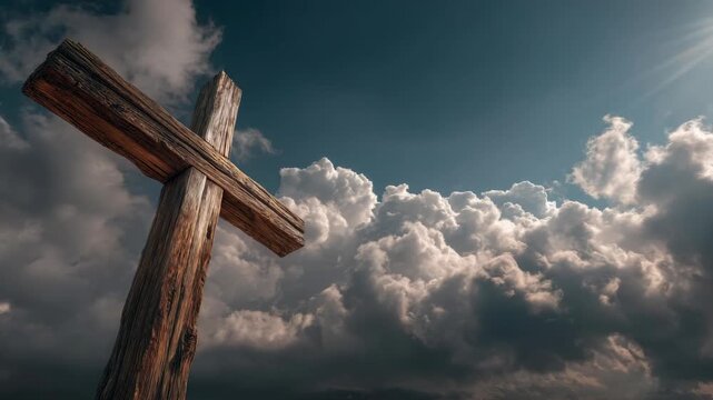 Rustic wooden cross standing tall under a dramatic sky with sun rays and thick clouds, symbolizing faith, spirituality, and divine presence