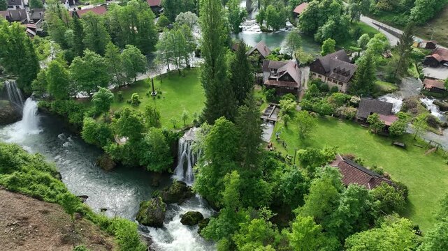 Watermill village Rastoke on rivers Slunj and Korana. Charming village of Rastoke with waterfalls, wooden houses, rivers running through. Aerial view of fairy-tale spring location in heart of Croatia