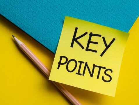 The word key points on yellow sticky note paper with a pencil and binder.