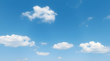 Obraz premium Tranquil skyscape with a vibrant blue sky and soft white cumulus clouds. Concept of freedom and peace.
