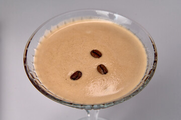A Decadent Dessert Drink Featuring Creamy Coffee Flavors and Garnished with Coffee Beans, Perfect for Indulging Your Sweet Tooth at Any Occasion