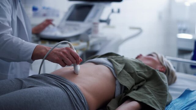 Female patient undergoing abdominal ultrasound screening.