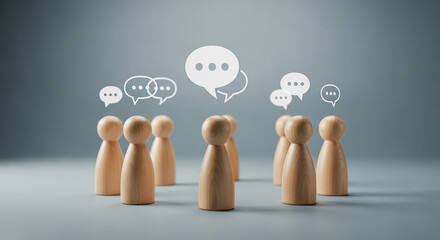 Group discussion communication concept with wooden human figures and speech bubbles representing teamwork brainstorming ideas dialogue and community connection

