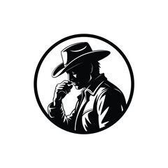 Silhouette of a cowboy in a hat contemplating