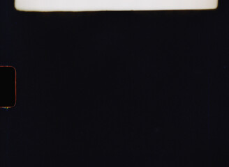 Authentic black 8mm film background with light leaks and frame number