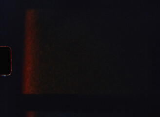 Light leak creating an orange glow on 8mm film background
