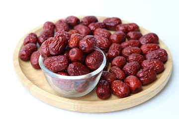 Natural sweet dried jujube in a glass cup. Healthy fruit. Side view