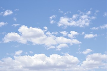 Fototapeta premium Bright blue sky with fluffy white clouds.