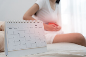 Fototapeta na wymiar stomach ache. Asian women have abdominal pain, indigestion, gastritis, menstrual cramps, flatulence, diarrhea, distention, colon cancer, belly inflammation problem, suffer food poisoning, abdomen