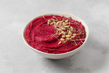 Top view beet hummus. Healthy and vegetarian snack concept.