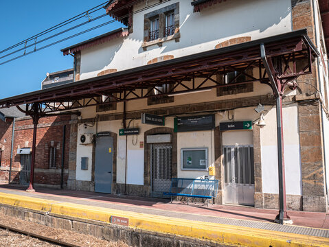 Toral de los Vados, Leon, Spain, 06-16-2025: The passenger building at Toral de los Vados station is completely empty in the morning, next to the platform and a platform located outside