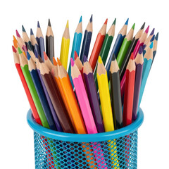 Fototapeta premium Collection of multi-colored wooden pencils standing in a bright blue cup against a clean white background, symbolizing creativity and education