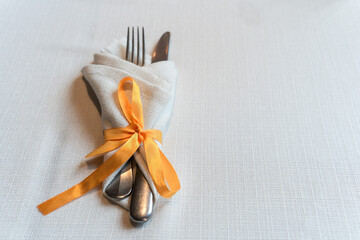 Elegant Cutlery Wrapped in Napkin with Ribbon