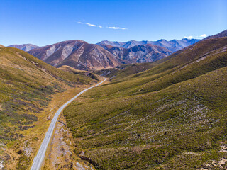 Aerial drone view of Trig M summit and saddle above Porters Pass overlooking Lake Lyndon and...