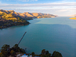 Aerial view of Governors Bay jetty near Lyttelton, Banks Peninsula, South Island, New Zealand, with...