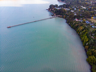Aerial view of Governors Bay jetty near Lyttelton, Banks Peninsula, South Island, New Zealand, with...