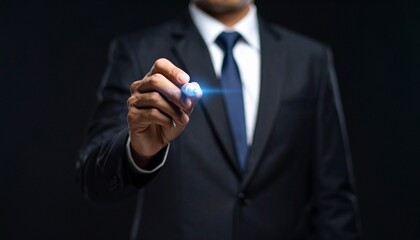 Business wallpaper of a man in a suit holding a pen and pointing somewhere
