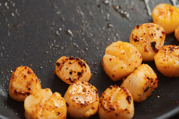 frying scallops on non stock pan closeup