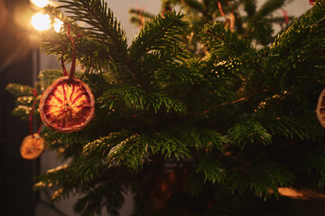Closeup small christmas tree with natural decorations indoor