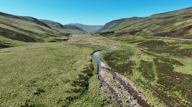 flight over a highland landscape in the Cairn Gorm National Park in Scotland, UK
