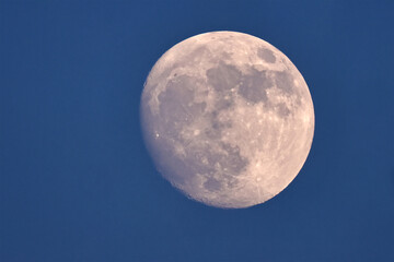 full moon over blue sky