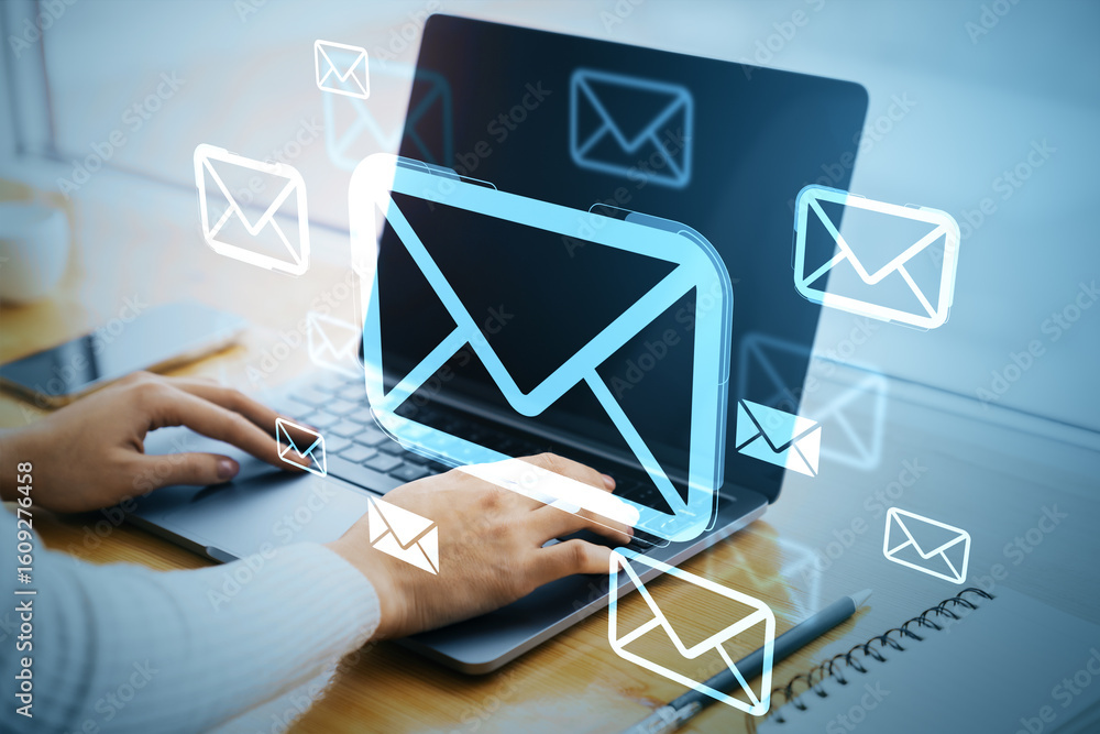 Aufkleber digital email communication concept with envelope icons over laptop screen on modern office desk bac