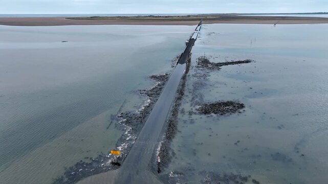 flight over the flooded Causeway to Holy Island , Northumbria, England, UK
