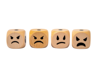 Wooden dice displaying various emotions, conveying anger, sadness, and frustration for design concepts