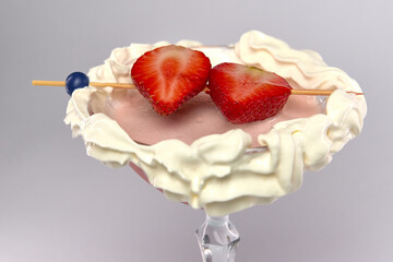 Delightful Dessert Martini with Fresh Strawberries and Whipped Cream, Perfectly Garnished for an...